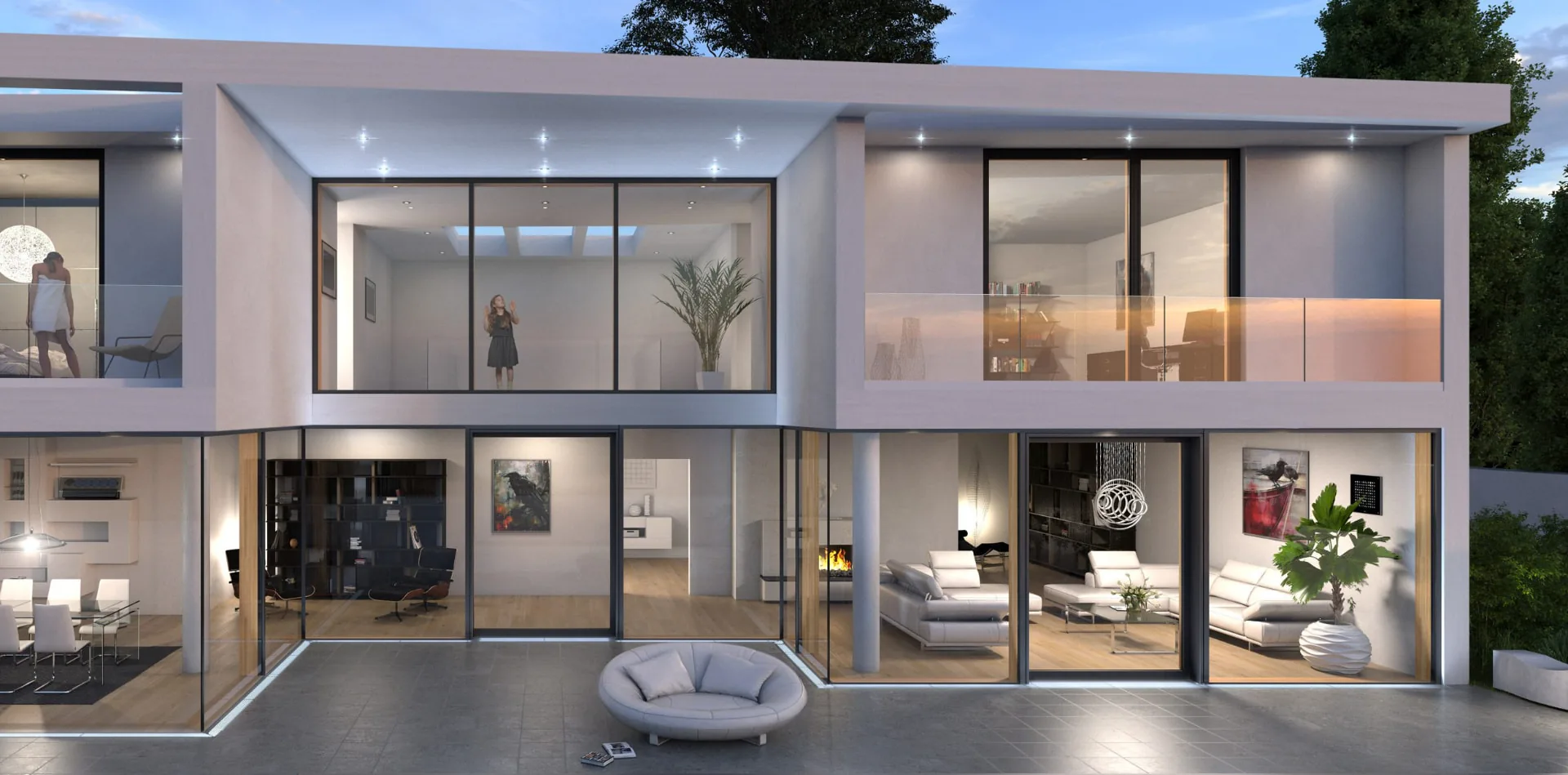 Vivienda de dos plantas al anochecer con fachada SKYWALL de madera-aluminio y correderas elevables